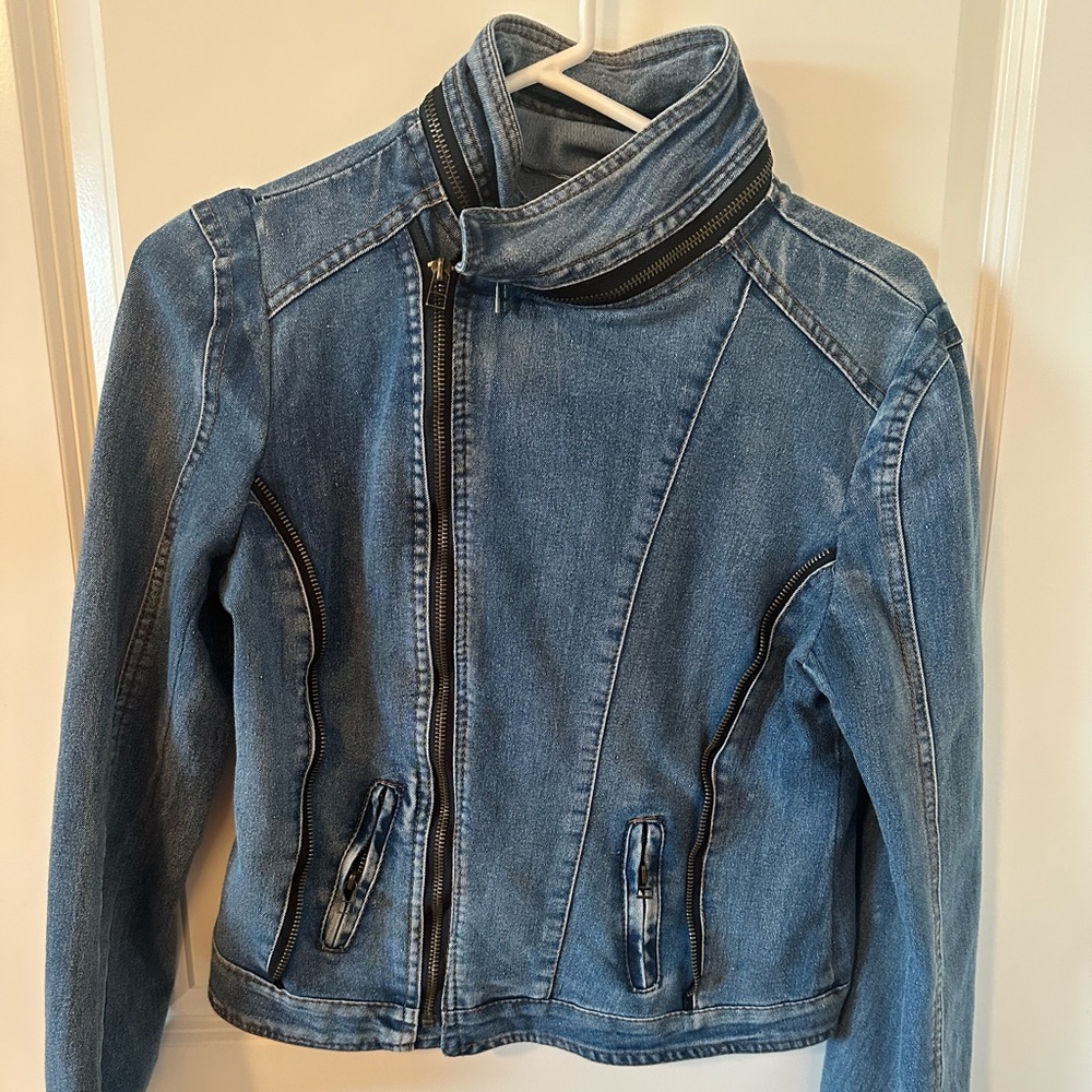 Designer Jean jacket never worn. Size large fits like a medium.